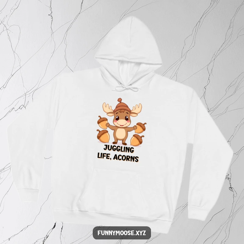 Funny Moose Hoodie, a cheerful moose in a hat juggling acorns, comfortable and humorous apparel.