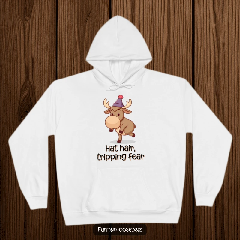 Funny hoodie art of a silly moose wearing a small hat, comically caught mid-trip over its feet.