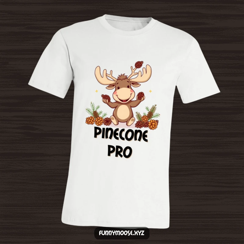 Funny t-shirt graphic of a comical moose with massive antlers joyfully juggling several pinecones.